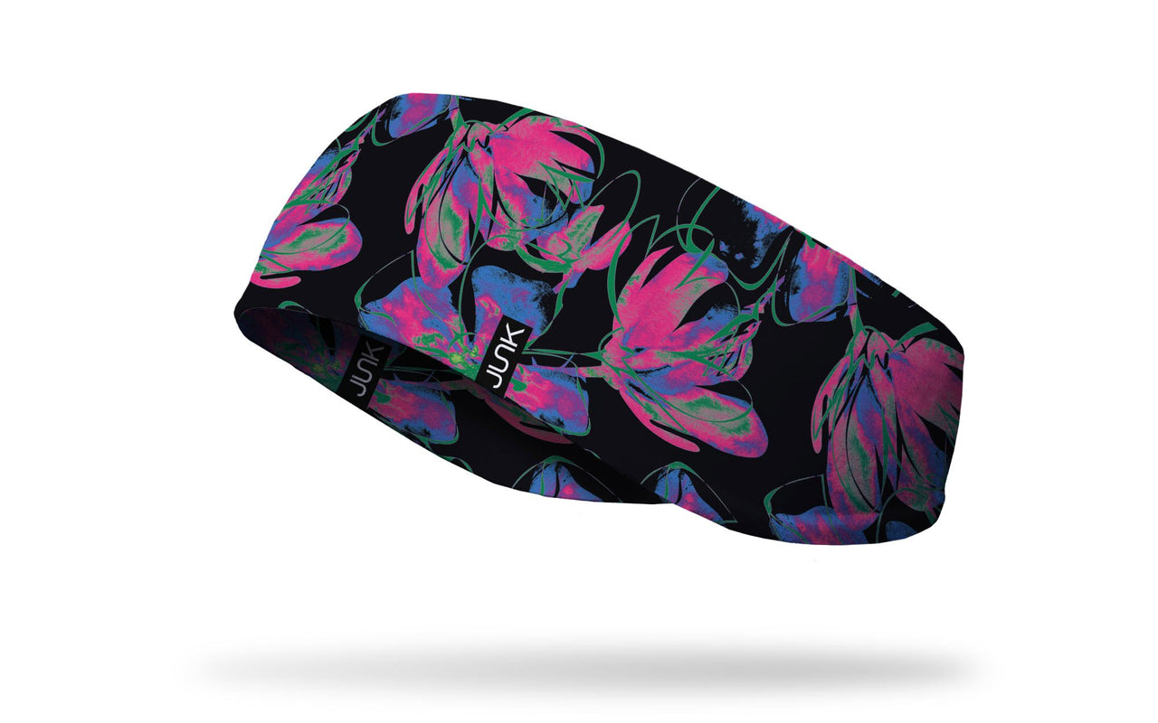 black ear warmer with repeating pattern of neon flowers