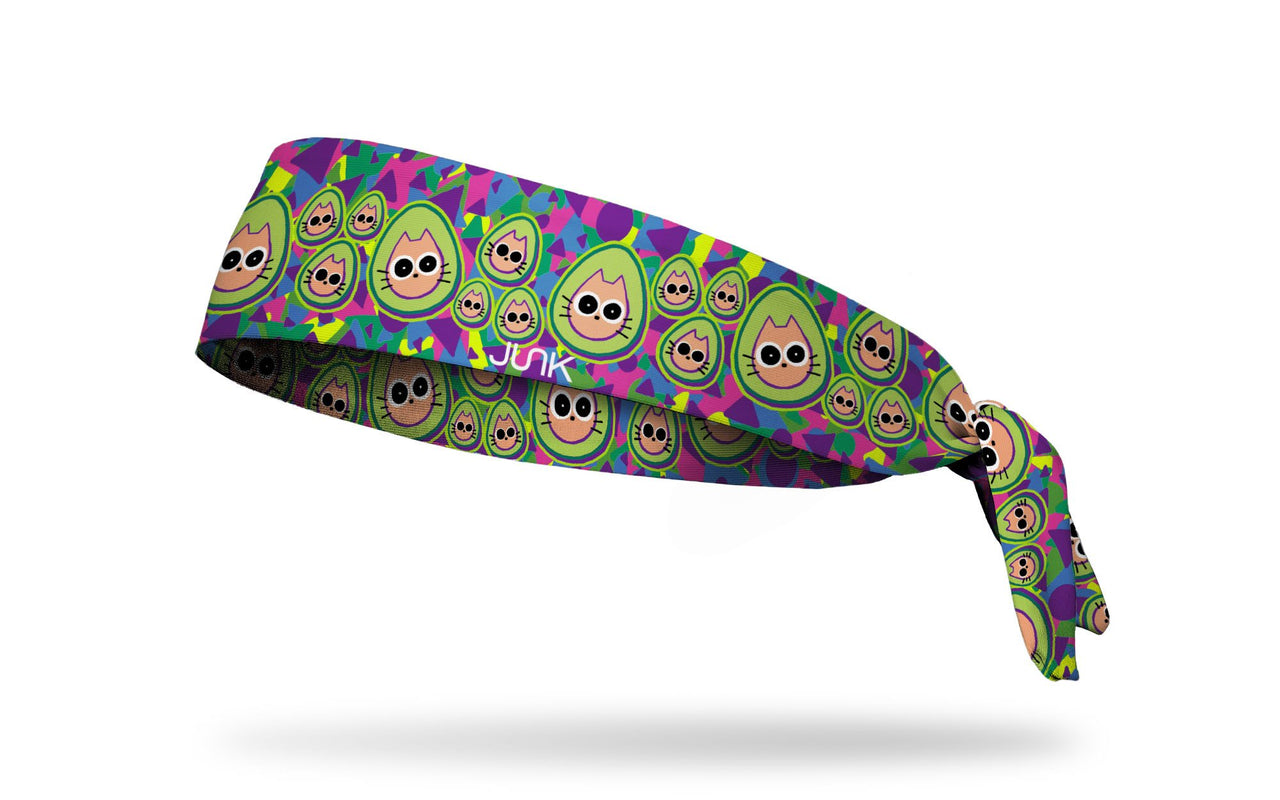 brightly colored headband with repeating pattern of cats dressed like avocados