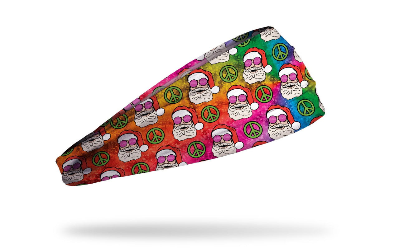 tie dye winter christmas themed headband with repeating pattern of santas wearing rose colored glasses and peace signs