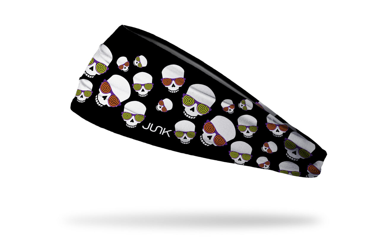 black headband with repeating pattern of skulls wearing hypnotizing glasses