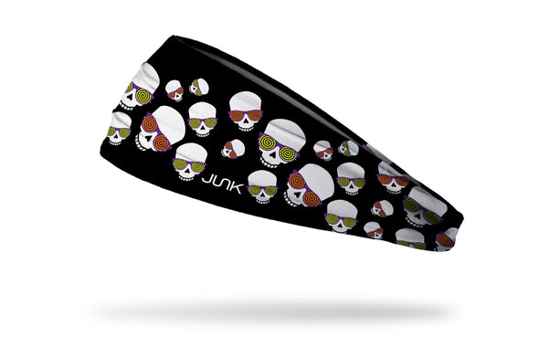 black headband with repeating pattern of skulls wearing hypnotizing glasses