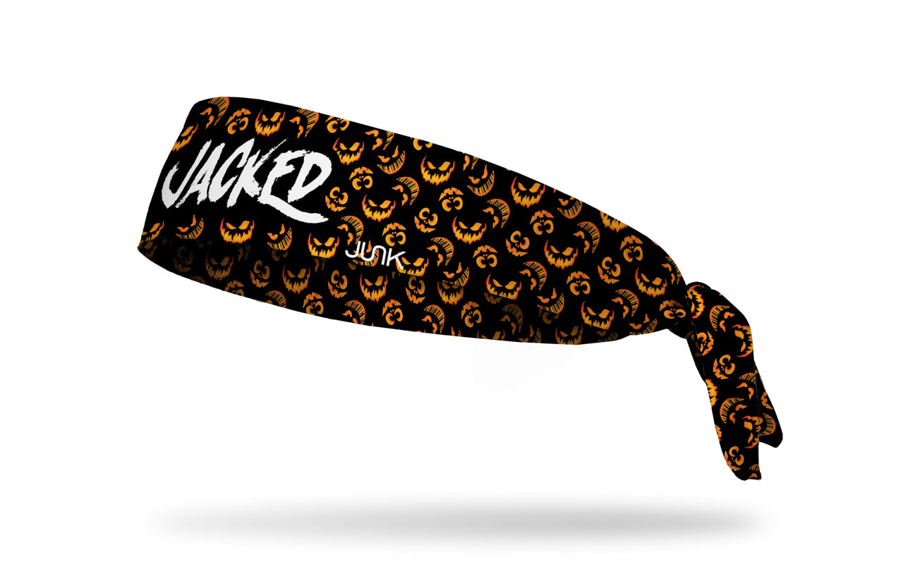black headband with pattern of jack o lanterns and Jacked wordmark