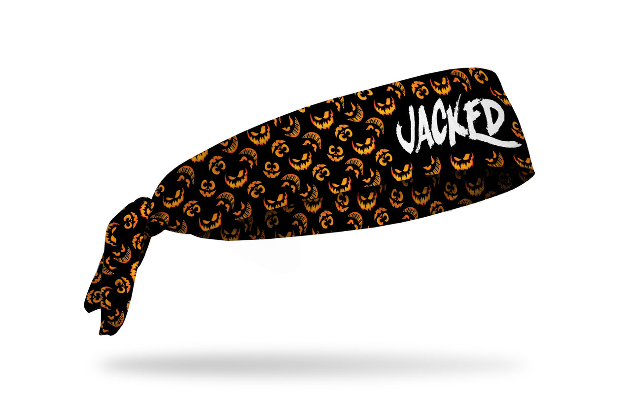 black headband with pattern of jack o lanterns and Jacked wordmark