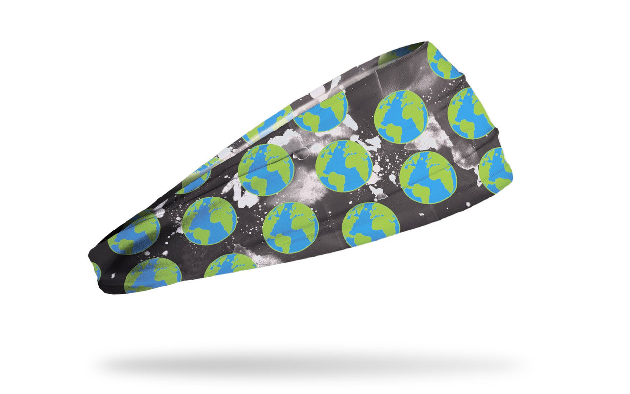 black headband with white paint splatter and images of earth repeating pattern
