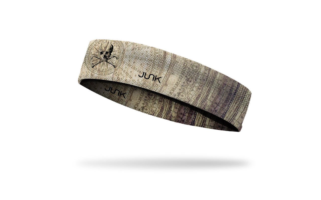 faded khaki headband with map design and skull and crossbones in middle
