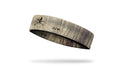 faded khaki headband with map design and skull and crossbones in middle