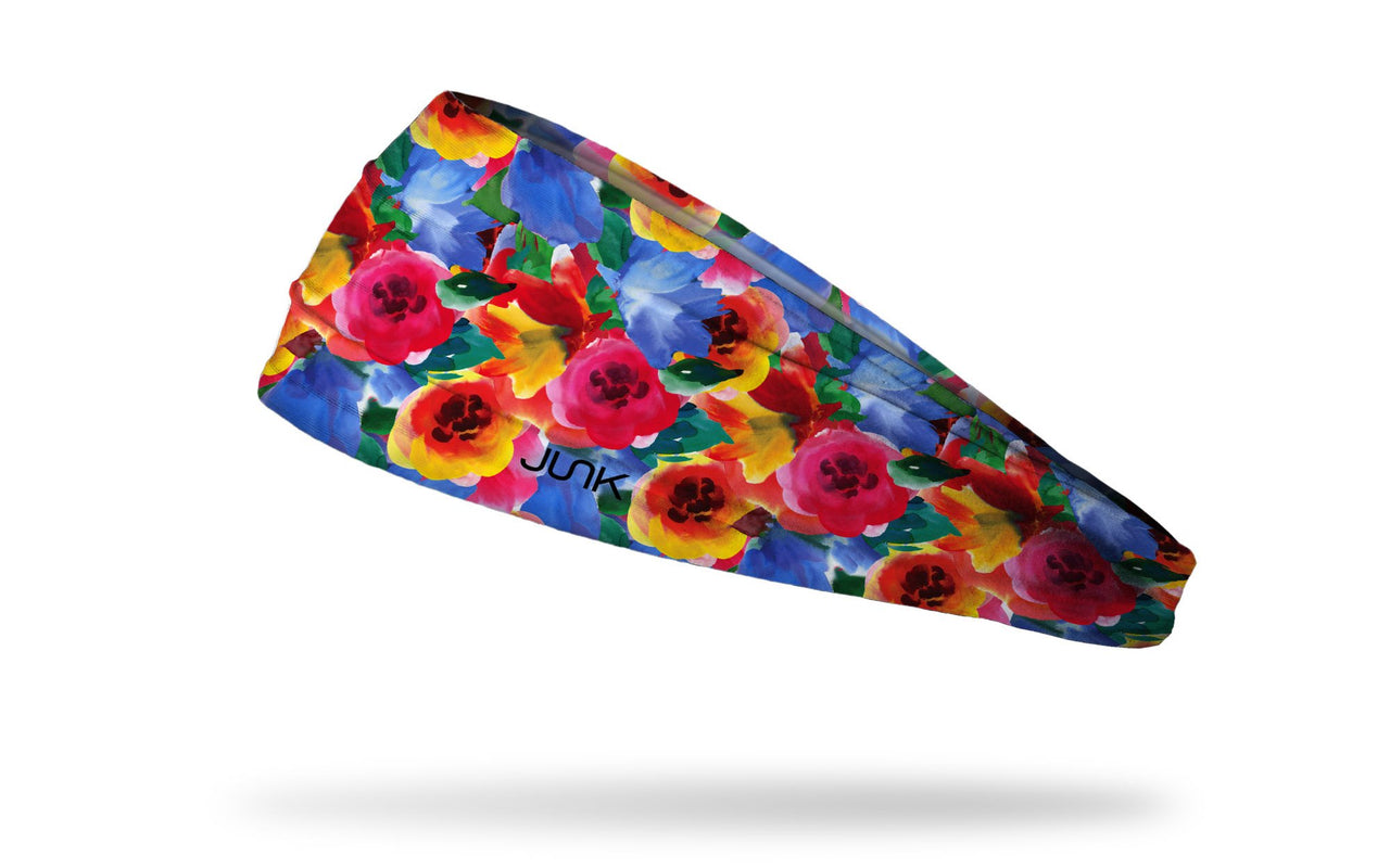 brightly colored headband with repeating pattern of flowers in watercolor
