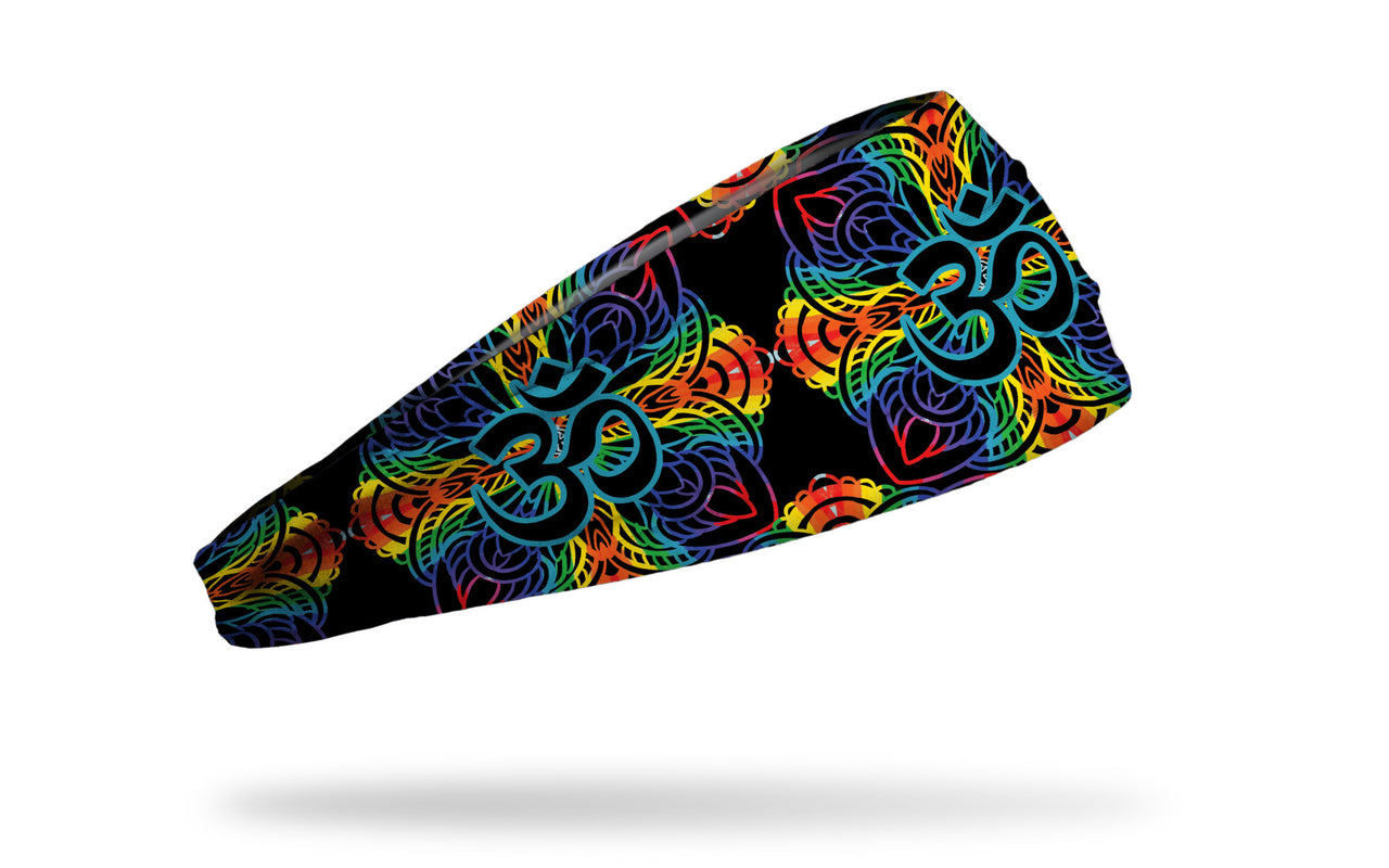 intricate mandala like design in black outlined in rainbow colors headband with om symbol in center