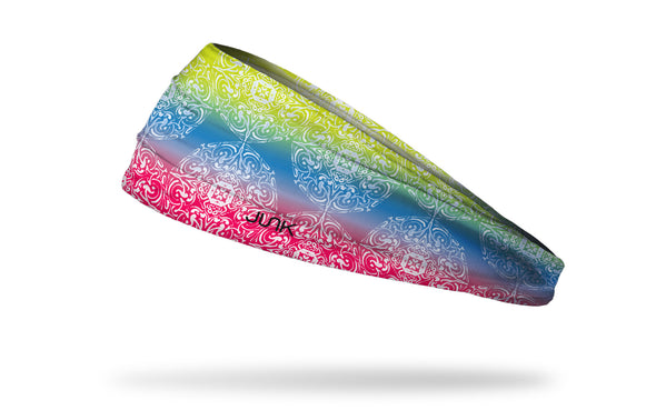 yellow, blue, and red gradient headband with white scrolling design pattern