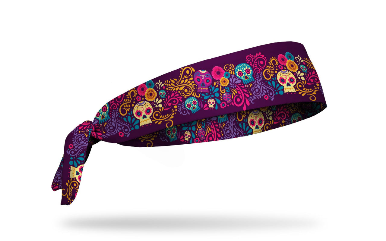dark purple headband with turquoise cream gold and bright pink floral accents and sugar skulls