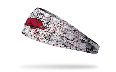 white headband with paint splatters and University of Arkansas logo