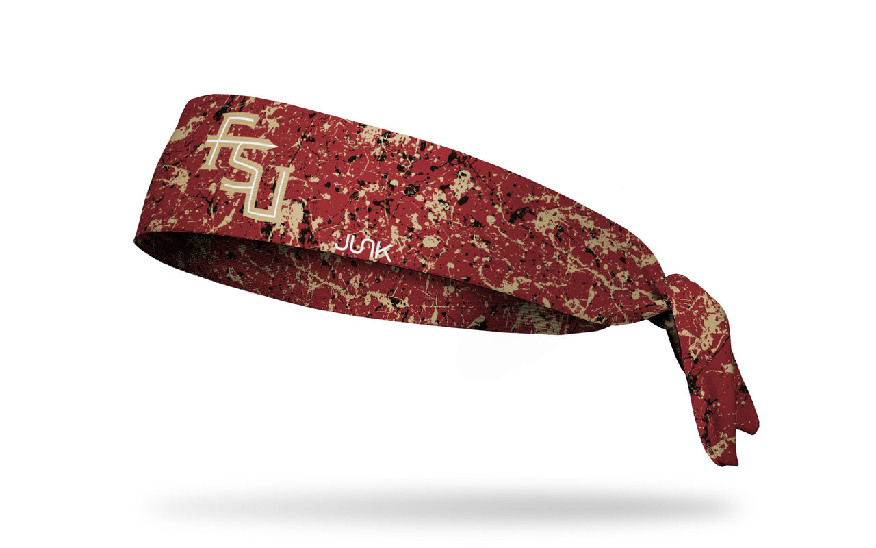 red headband with Florida State University logo and black paint splatter