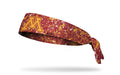 maroon headband with gold paint splatter and University of Minnesota M logo in gold