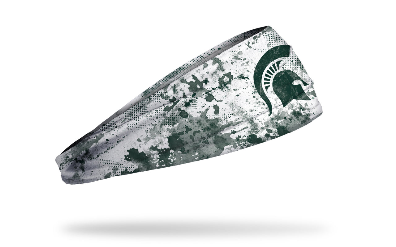 white headband with Michigan State University spartan logo in green with green grunge overlay