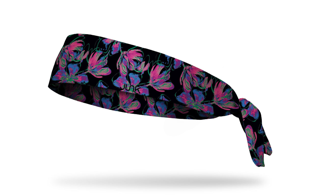 black headband with repeating pattern of neon flowers