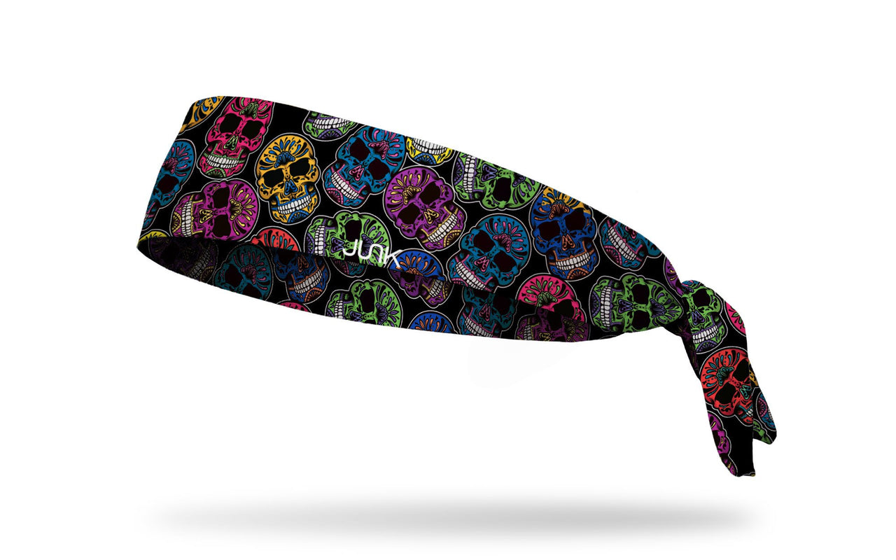 black headband with brightly colored random pattern of decorated skulls