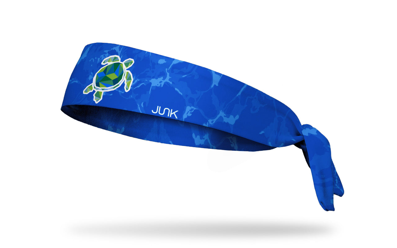 blue wave print headband with geometric sea turtle in center