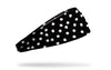 black headband with white dots that have been smudged to look like color bleed