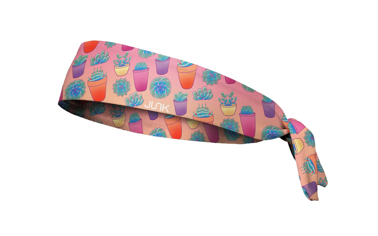 pink headband with repeating pattern of succulents