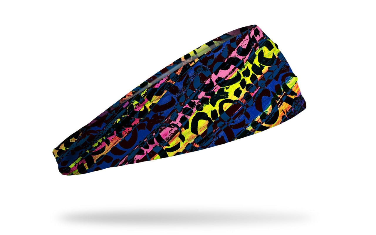 black headband with colorful yellow, blue, orange, and pink paint strokes and light x o writing repeating