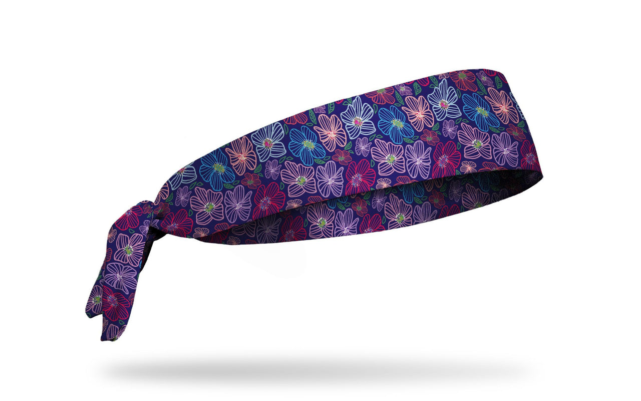 purple headband with repeating pattern of bright gem jewel colored tropical flowers
