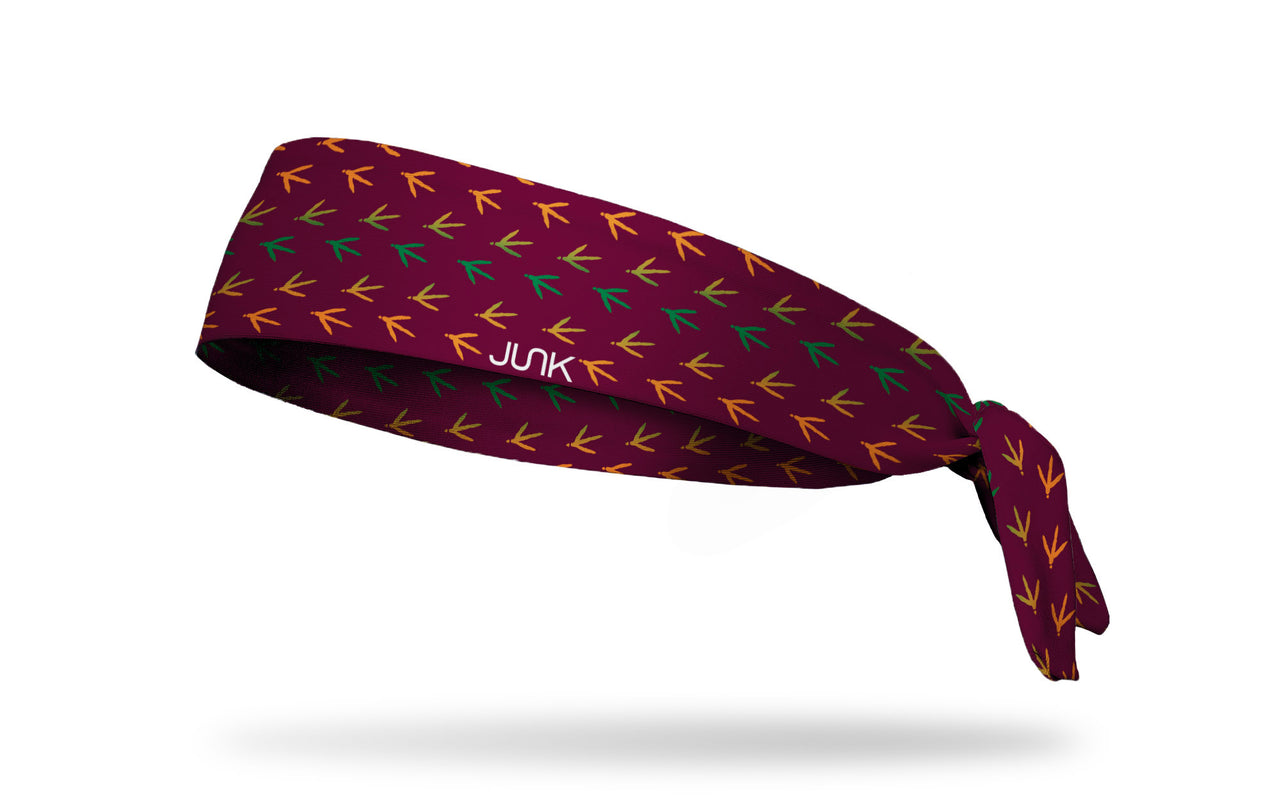 maroon wine headband with repeating pattern of colorful turkey tracks