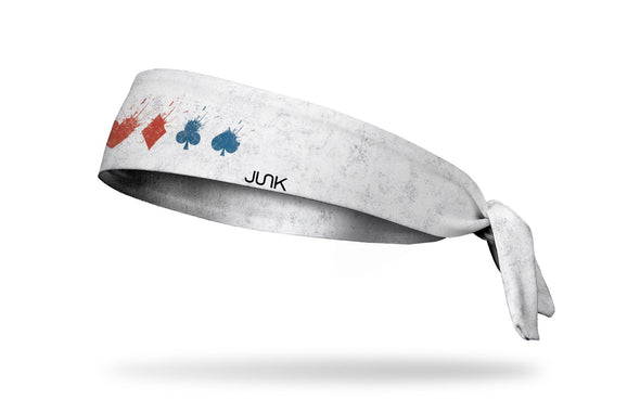 white headband with Harley Quinn full suit symbols that are exploding in blue and red