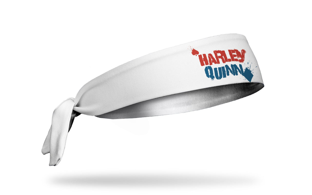 white headband with Harley Quinn wordmark graffiti logo in red and blue