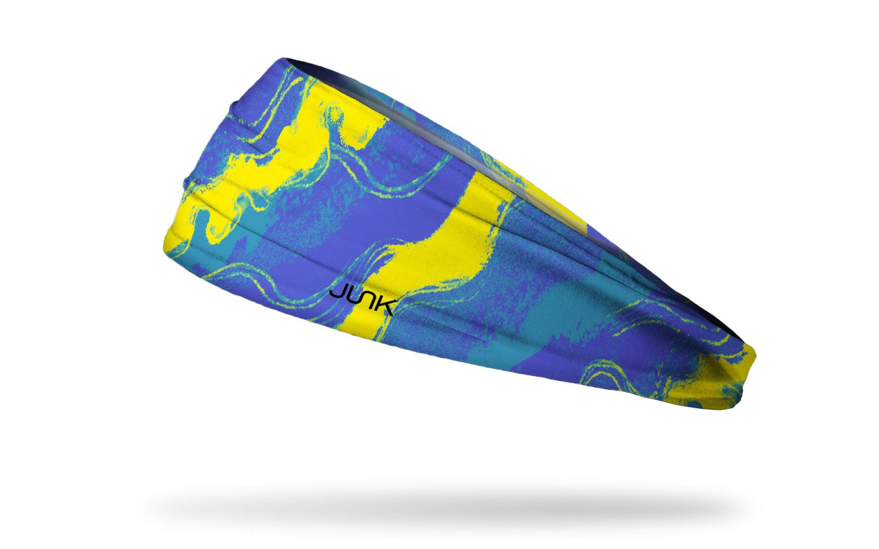 blue headband with wavy lines throughout and yellow streaks